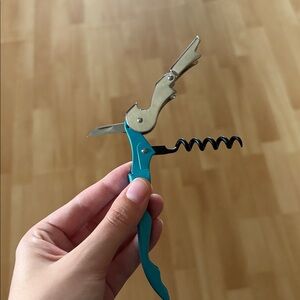 PRICED TO SELL Corkscrew and bottle opener tool in blue and silver